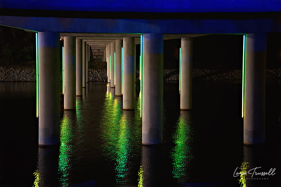 Emerald Reflections Beneath the Bridge